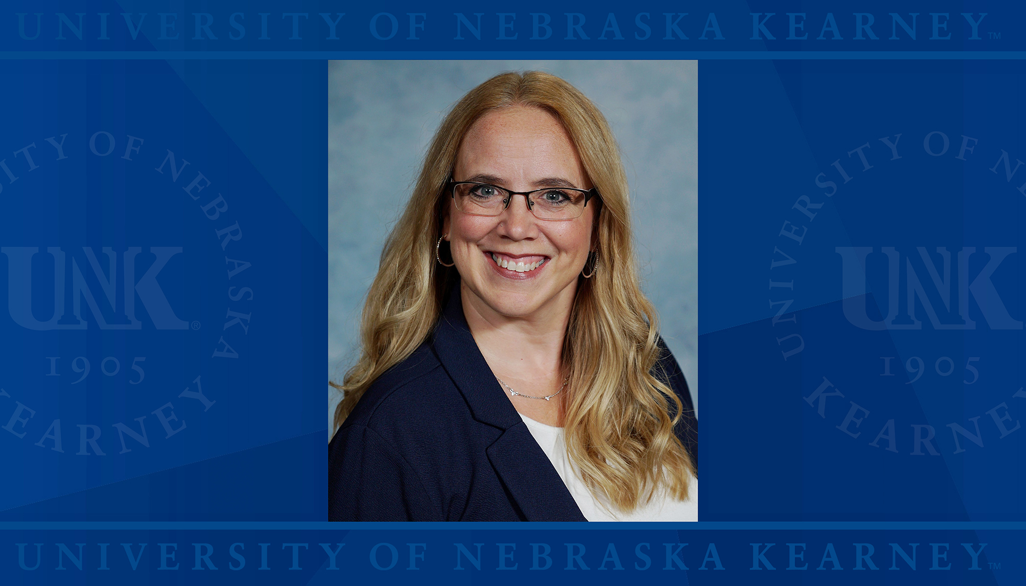 Angela Wright headshot over a UNK logo