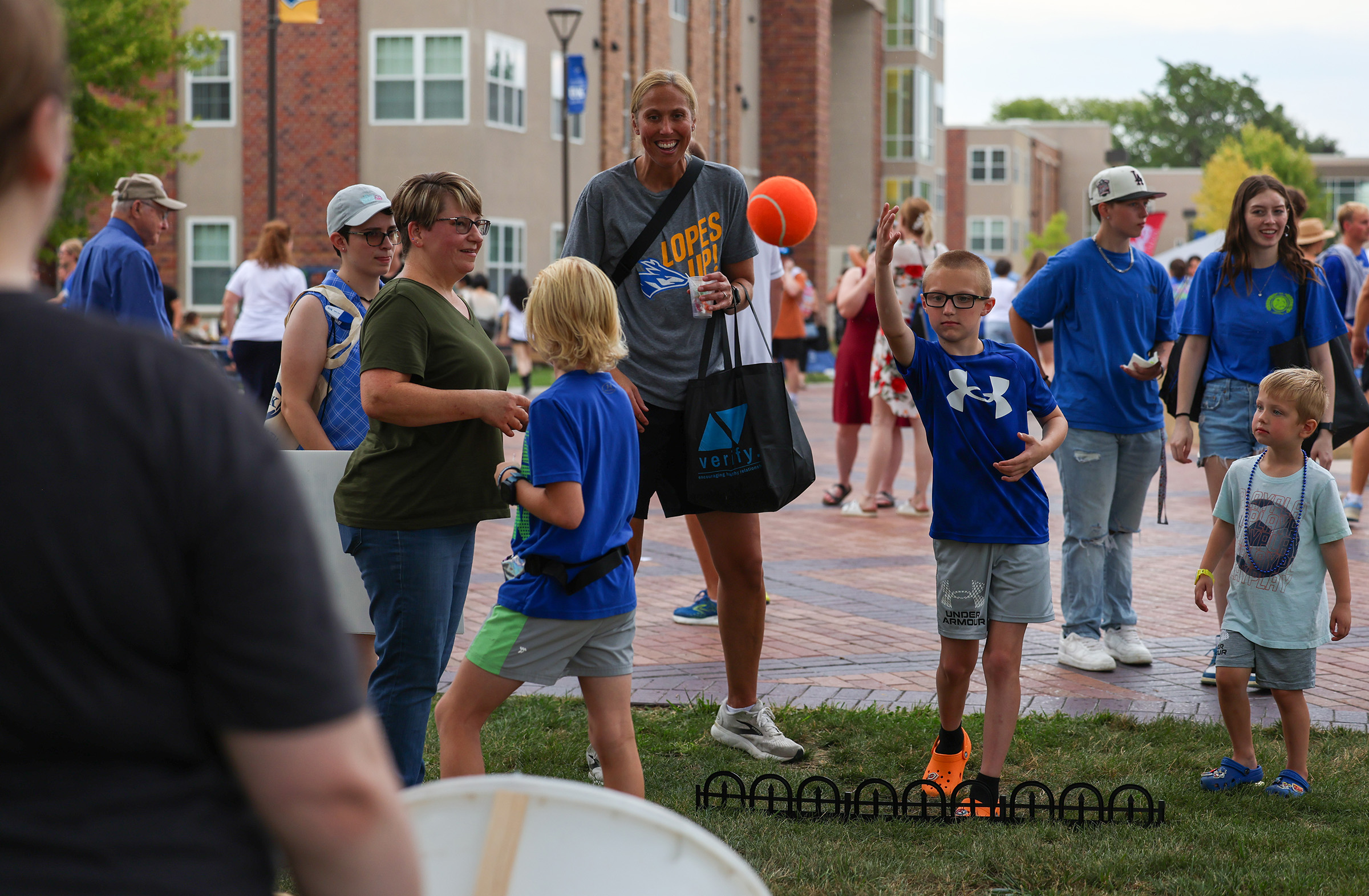 A family plays a game during Blue Gold Showcase at UNK.
