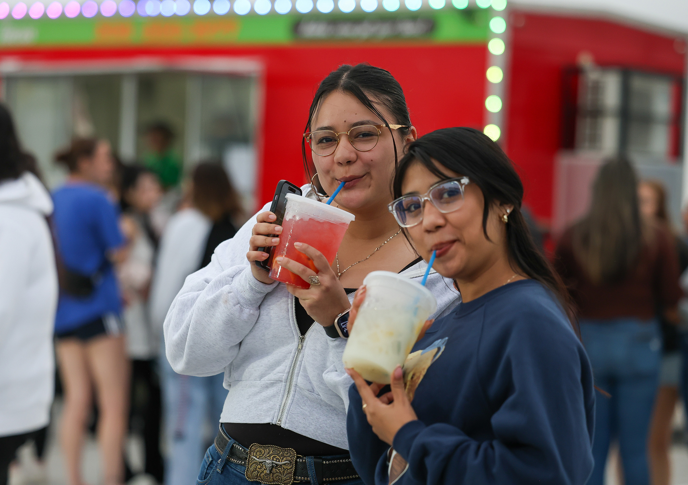 UNK students pose for a photo with lemonade during the Loper Lot Party.