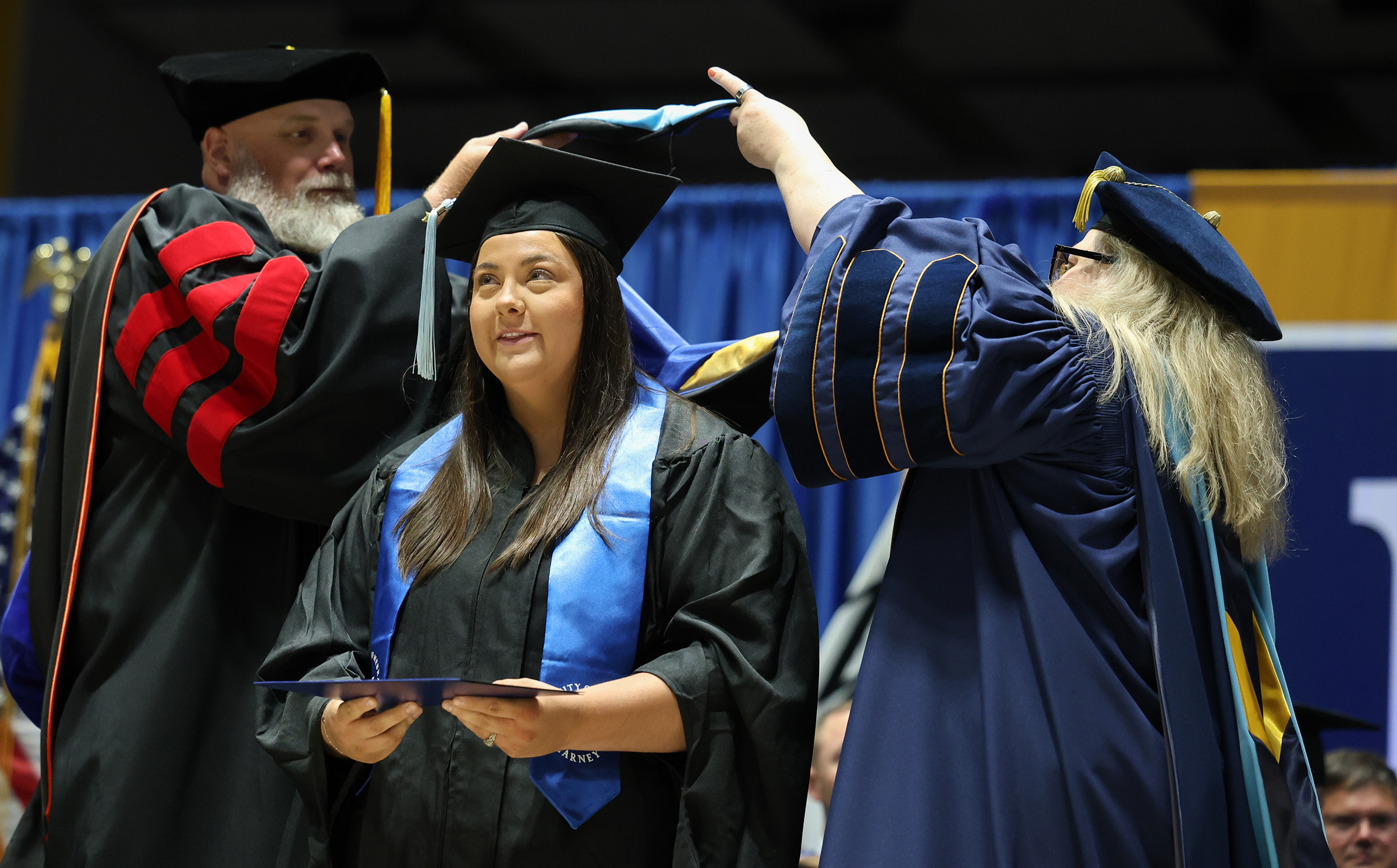 Cheyenne Fitzgerald receives her master’s degree from UNK during Friday’s summer commencement ceremony. 
