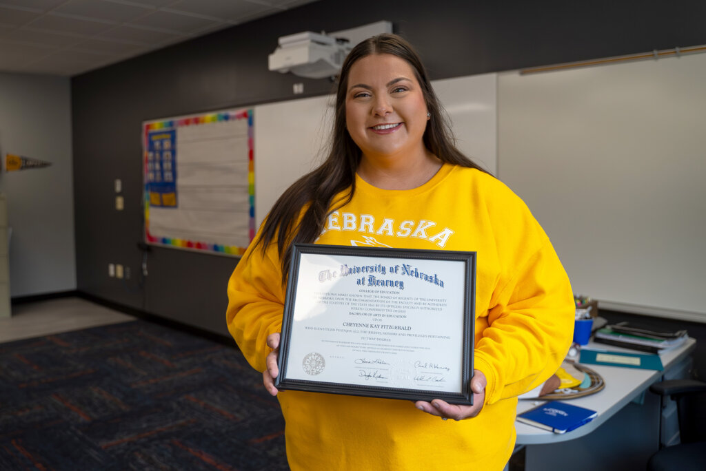 Cheyenne Fitzgerald is pictured with one of her three UNK degrees.