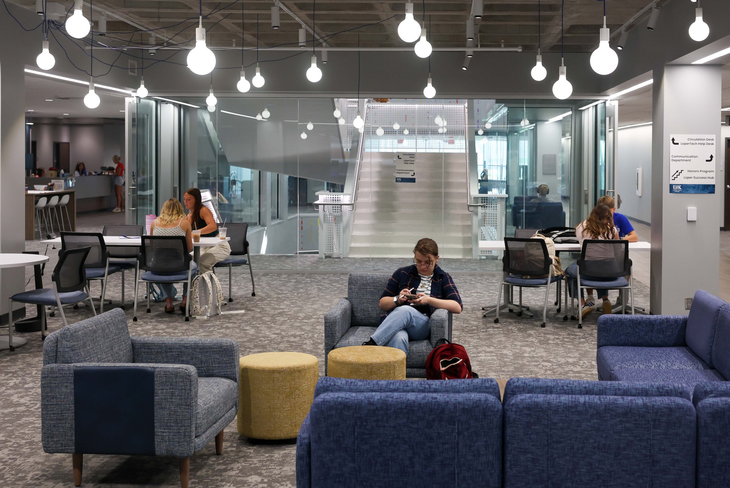Students sit in the library.