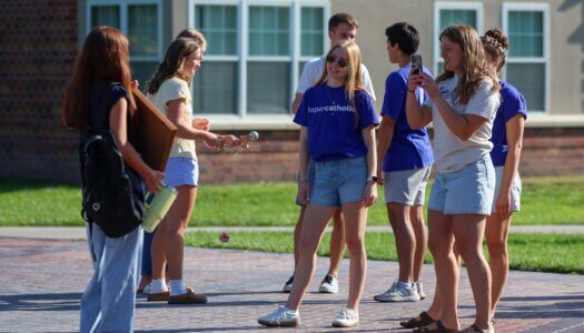 Students hang out by the fountain.
