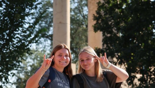 Students throw their lopes by the Bell Tower.