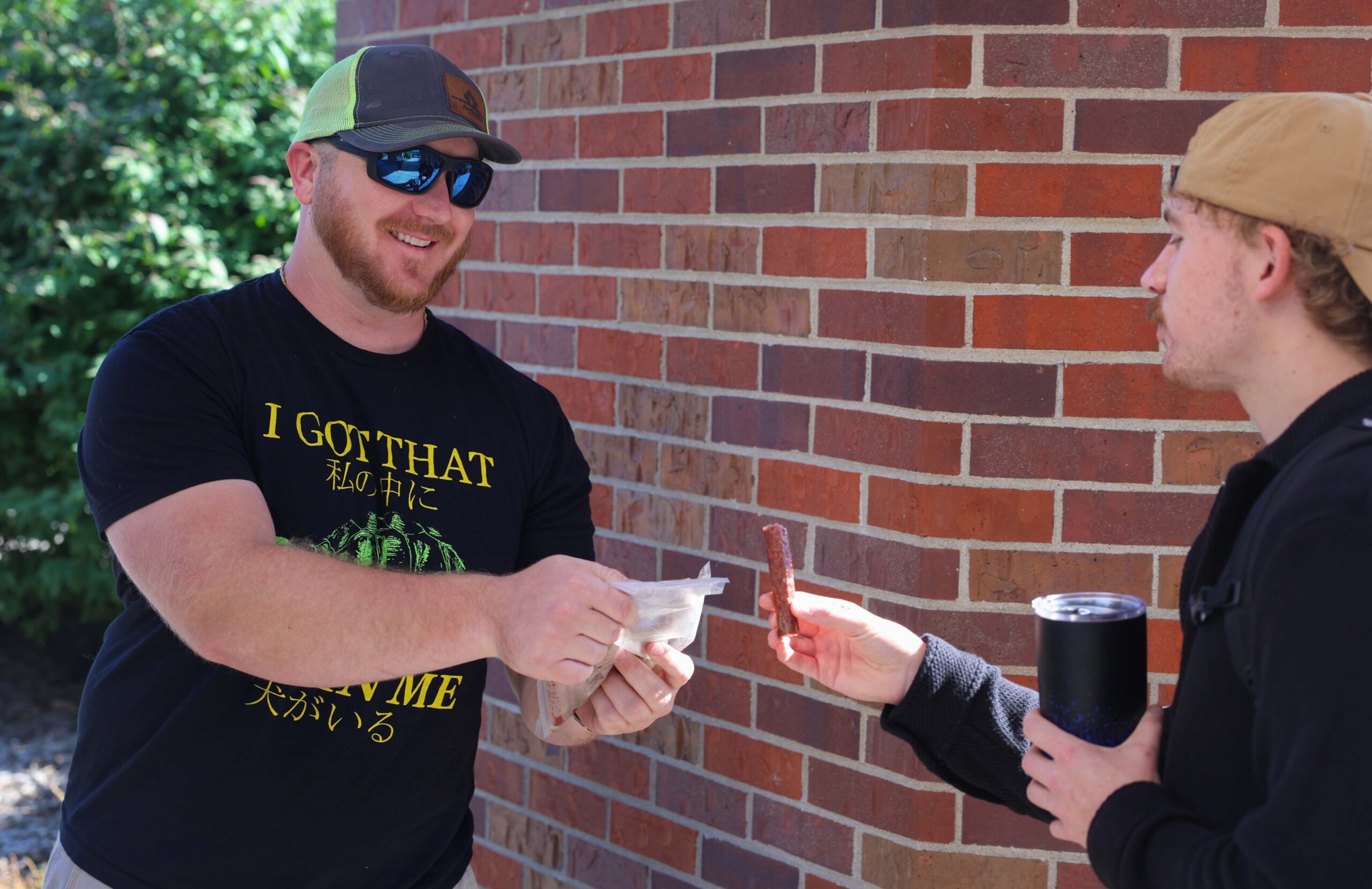 A student shares a snack.