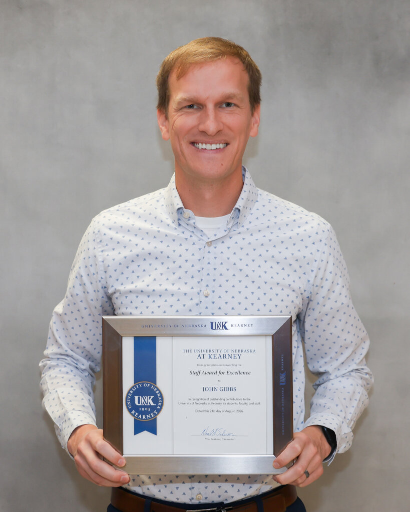 John Gibbs is pictured with his award