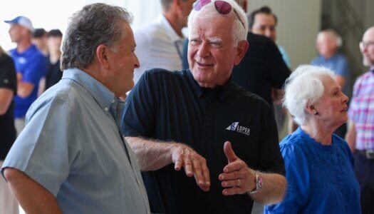 UNK Aviation faculty member Al Spain chats with state Sen. Stan Clouse.
