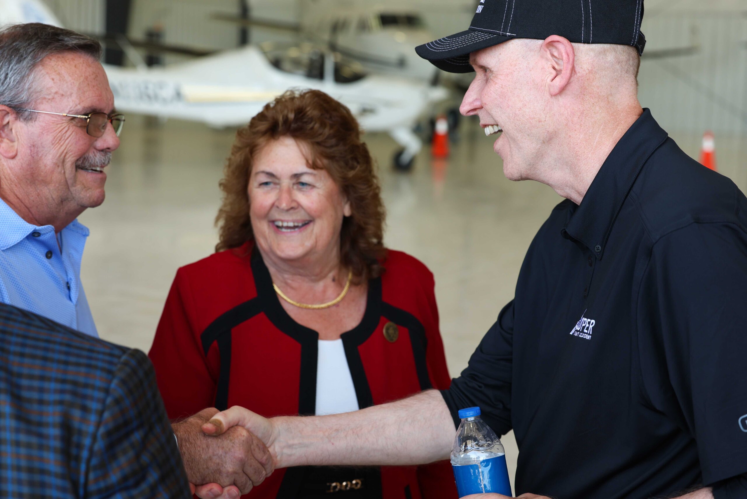 Chancellor Neal Schnoor greets guests during the Loper Flight Academy ribbon-cutting ceremony.
