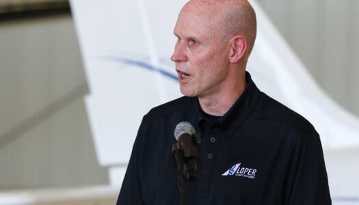 Chancellor Neal Schnoor speaks during the Loper Flight Academy ribbon-cutting ceremony.