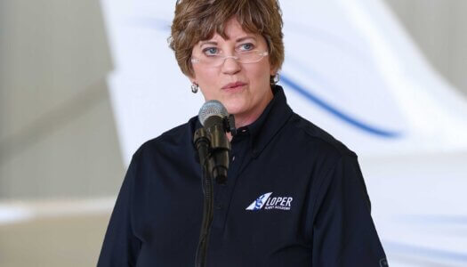 Brooke Envick speaks during the Loper Flight Academy ribbon-cutting ceremony.