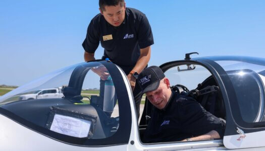 UNK Chancellor Neal Schnoor and assistant chief flight instructor Masahiro Suzuki land one of the Tecnam planes at Kearney Regional Airport during Thursday's ribbon-cutting ceremony celebrating the new Loper Flight Academy.