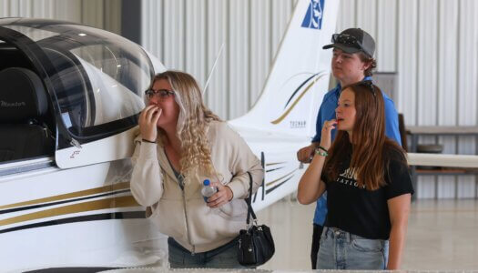Attendees check out one of the new planes during the Loper Flight Academy ribbon-cutting ceremony.