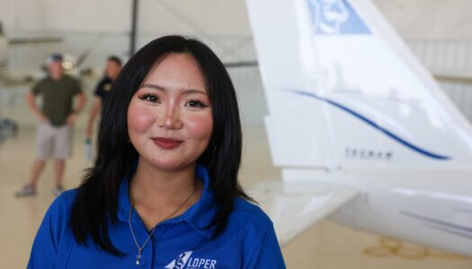 A Loper Flight Academy employee poses for a photo.