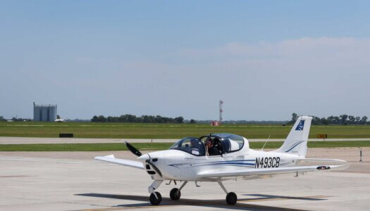 UNK Chancellor Neal Schnoor and assistant chief flight instructor Masahiro Suzuki land one of the Tecnam planes at Kearney Regional Airport during Thursday's ribbon-cutting ceremony celebrating the new Loper Flight Academy.