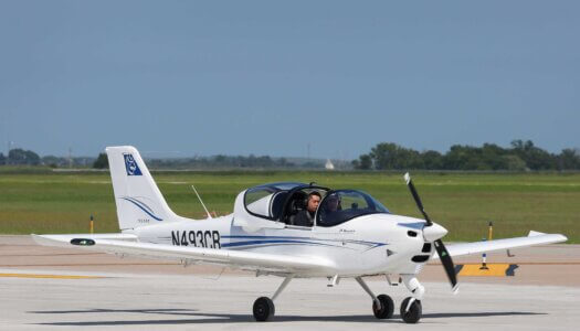 UNK Chancellor Neal Schnoor and assistant chief flight instructor Masahiro Suzuki land one of the Tecnam planes at Kearney Regional Airport during Thursday's ribbon-cutting ceremony celebrating the new Loper Flight Academy.