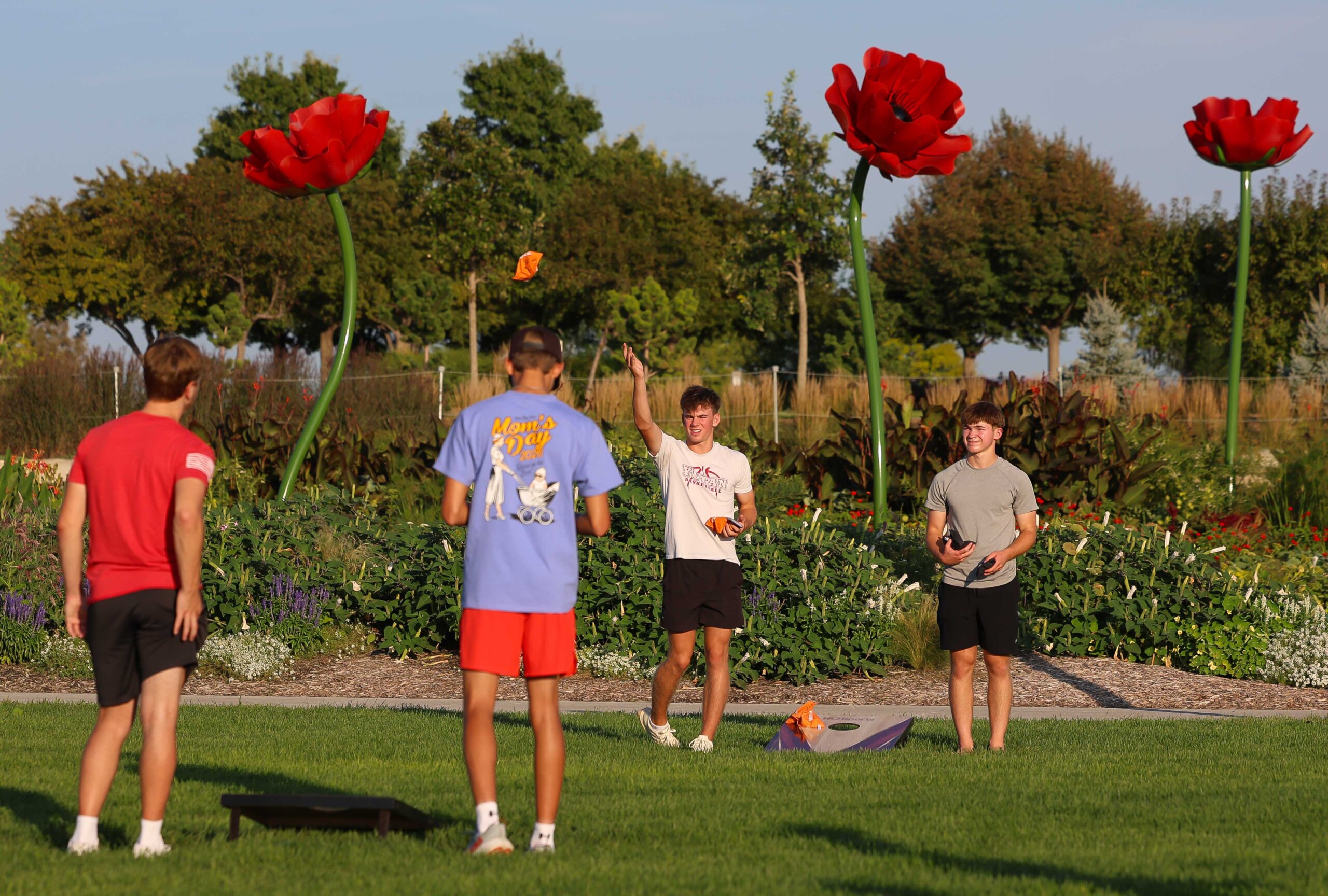 UNK students play cornhole during the Loper Lot Party.