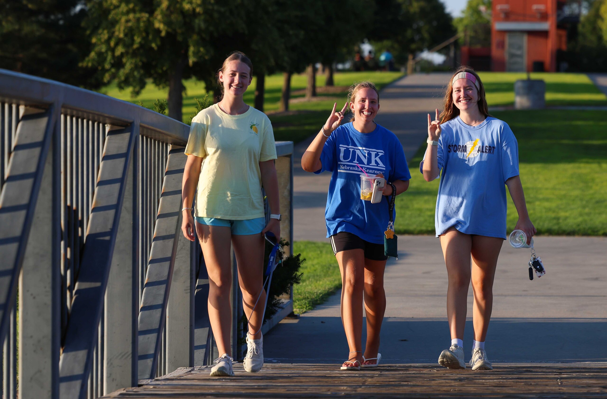 UNK students walk in Yanney Park.