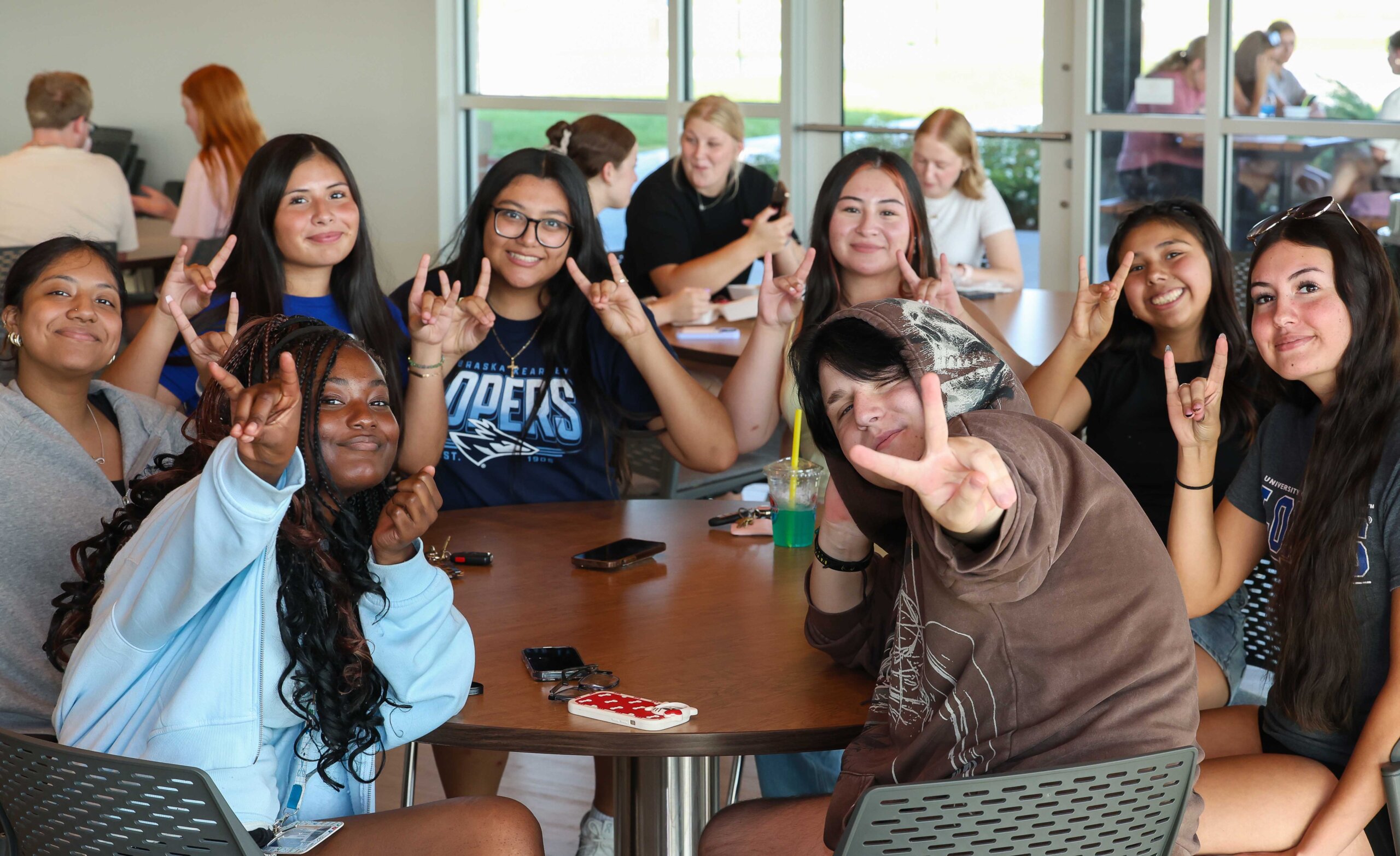 UNK students throwing the lopes.