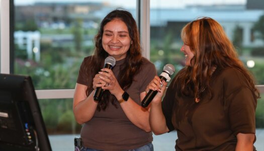 UNK students sing karaoke during the Loper Lot Party.