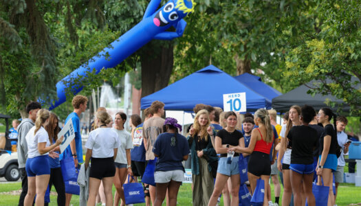 New students gather on campus greens.