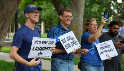 Family cheer on new students.