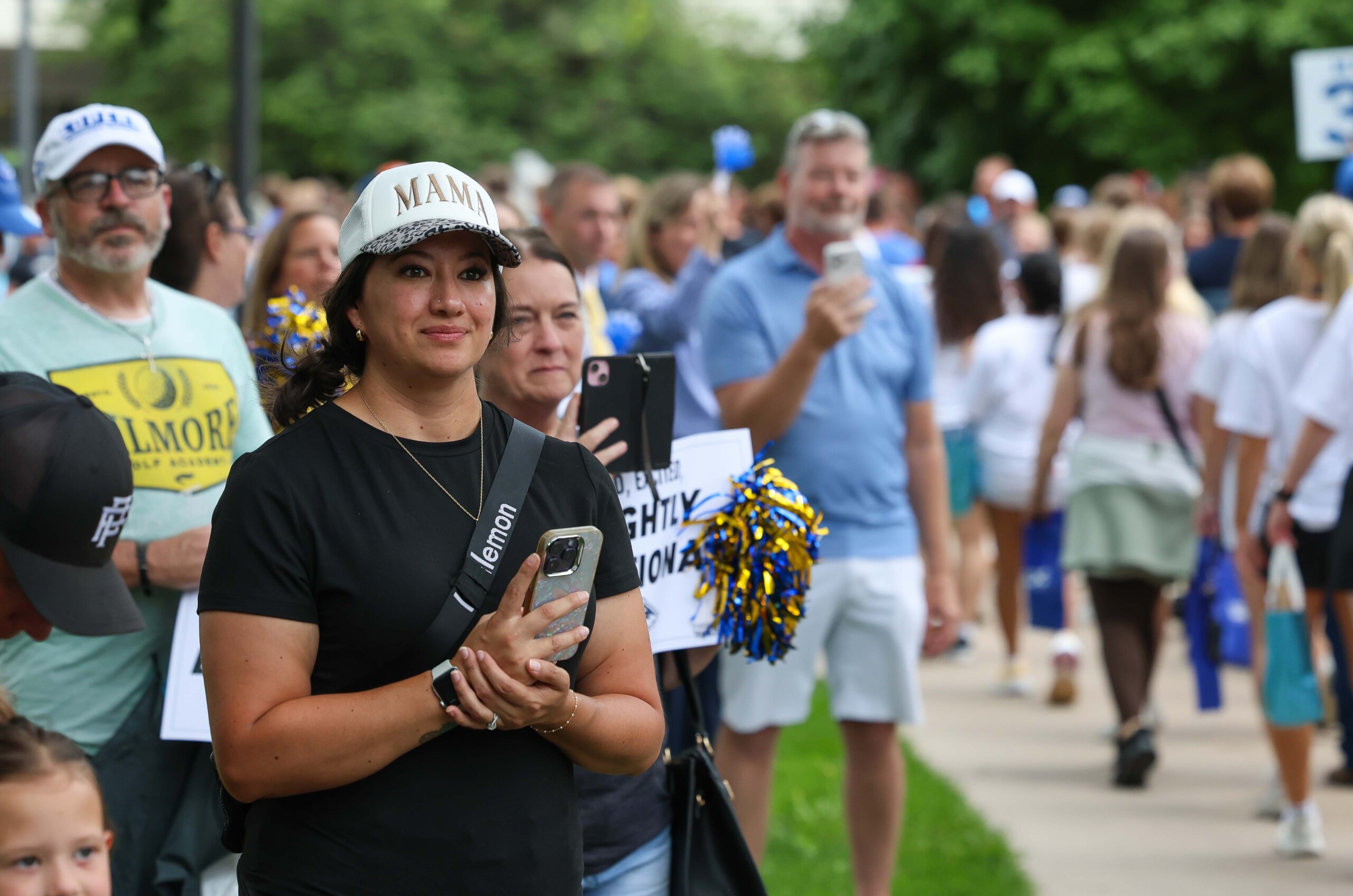 Family cheer on new students.