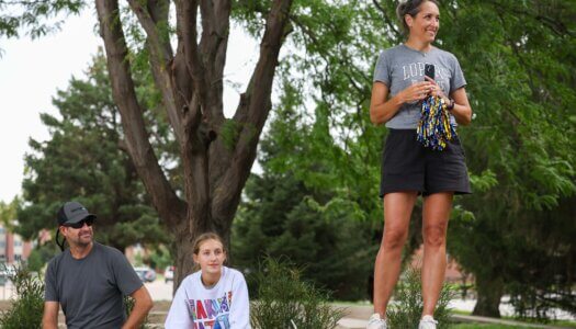Family cheer on new students.