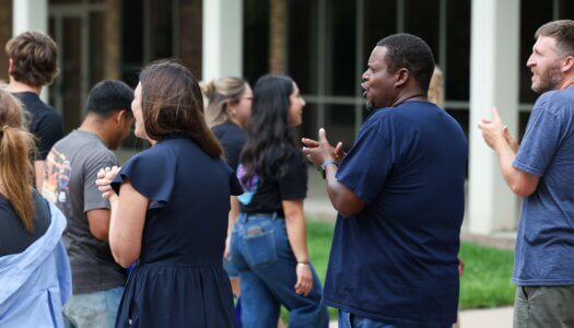 Staff cheer on new students during the Parade of Lopers.