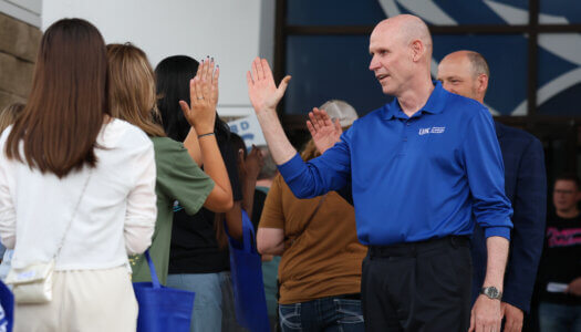 Chancellor Neal Schnoor high fives new students.