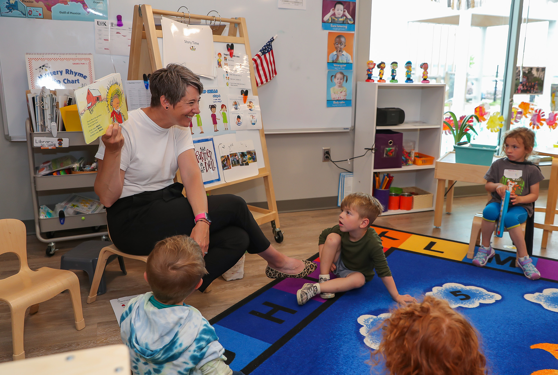 Young children listen to a story at the Plambeck Early Childhood Education Center.