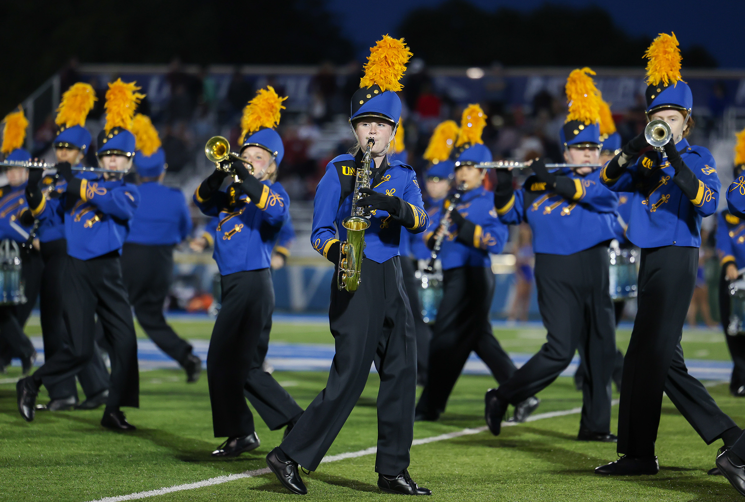 The Pride of the Plains Marching Band performs during a UNK football game.