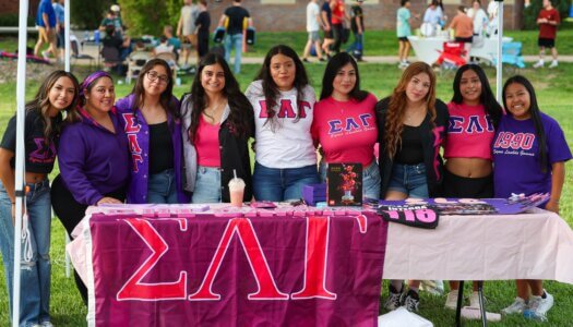 A UNK sorority poses for a photo.