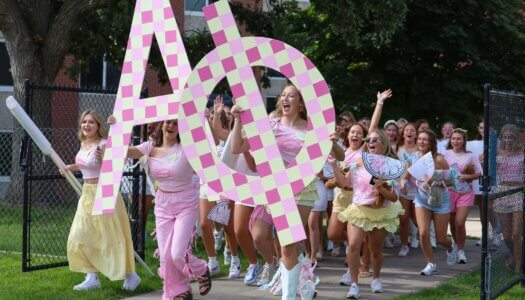 Alpha Phi storms the field for Bid Day.