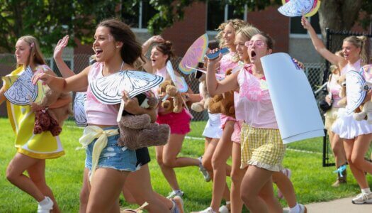 Alpha Phi storms the field.