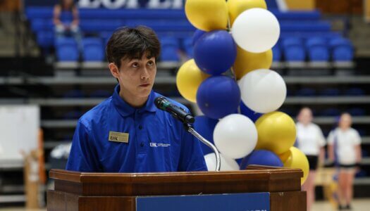 The Student and Family Transitions student leader speaks at convocation.
