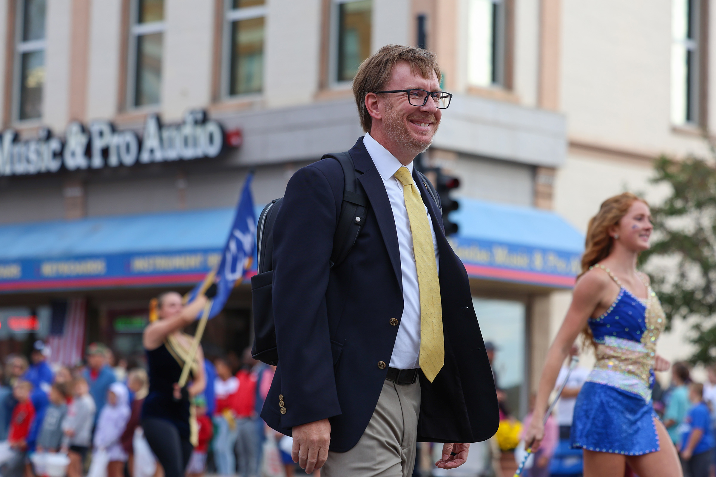Brian Alber leads the Pride of the Plains Marching Band during the UNK Homecoming Parade.