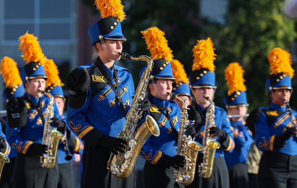 The Pride of the Plains Marching Band performs.