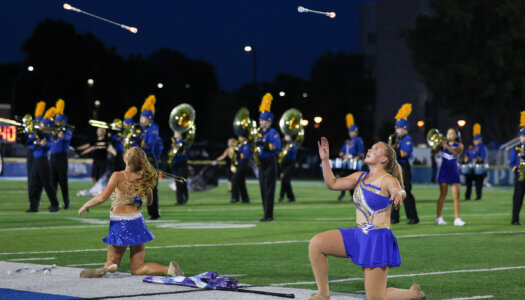 The Pride of the Plains Marching Band performs.