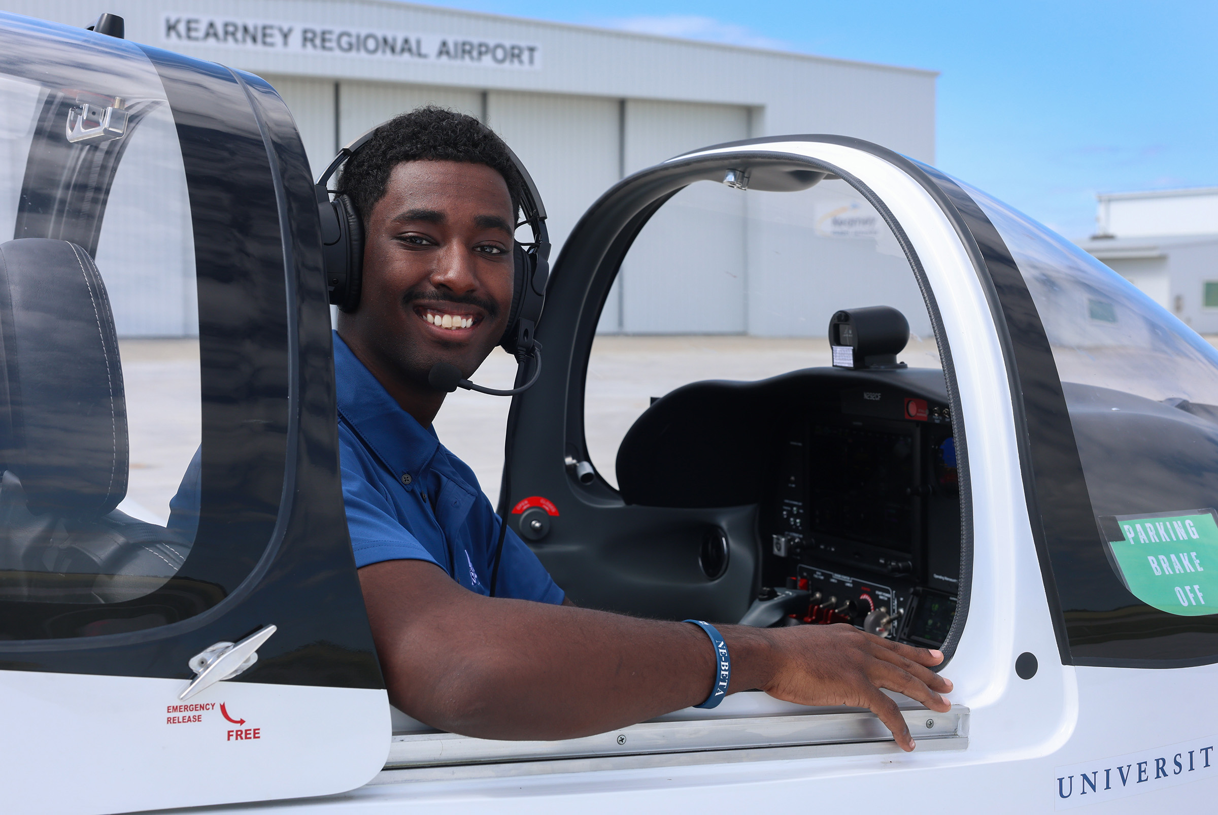 Fila Yusuf is pictured inside a plane at the Loper Flight Academy.