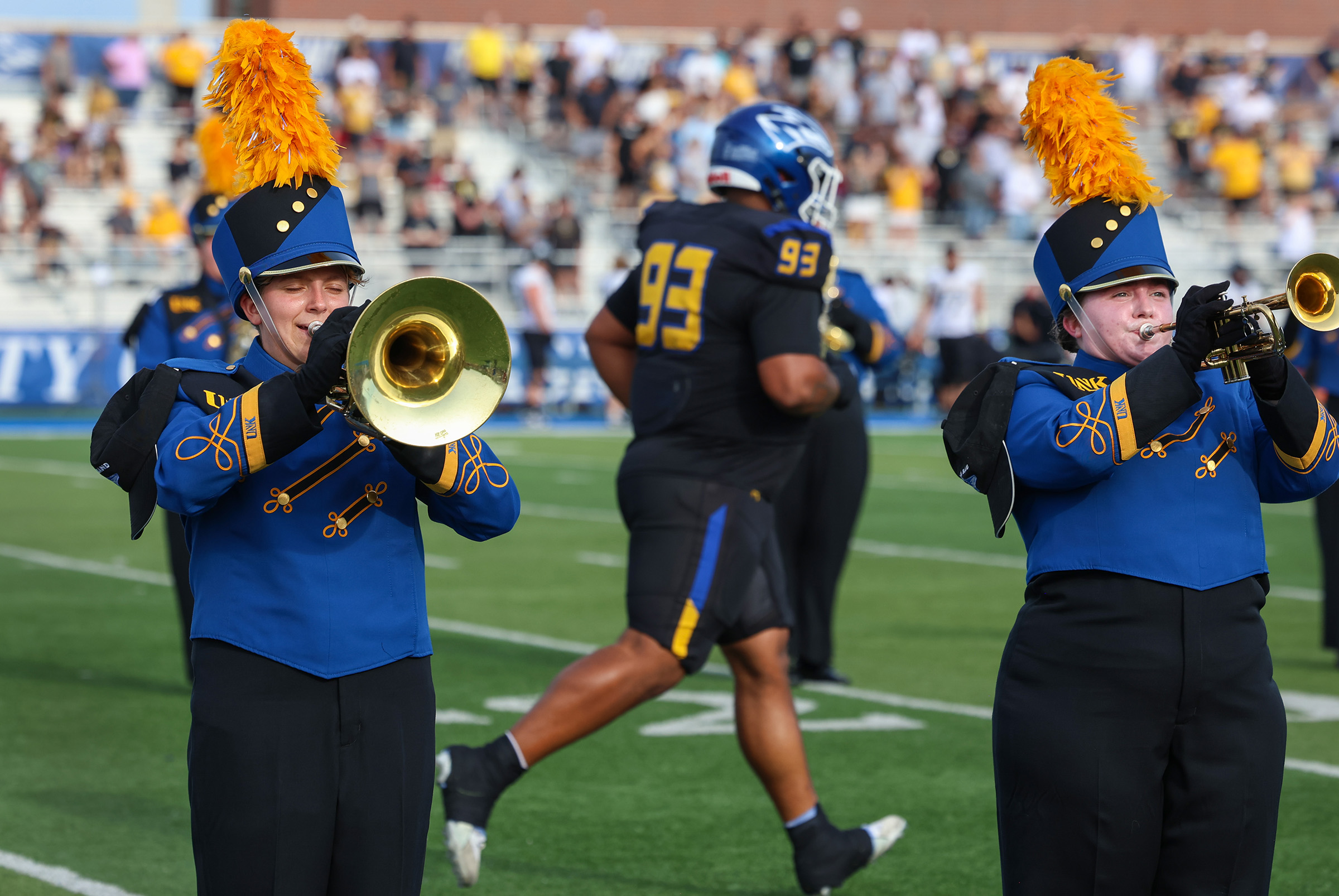 The Pride of the Plains Marching Band performs during a UNK football game.