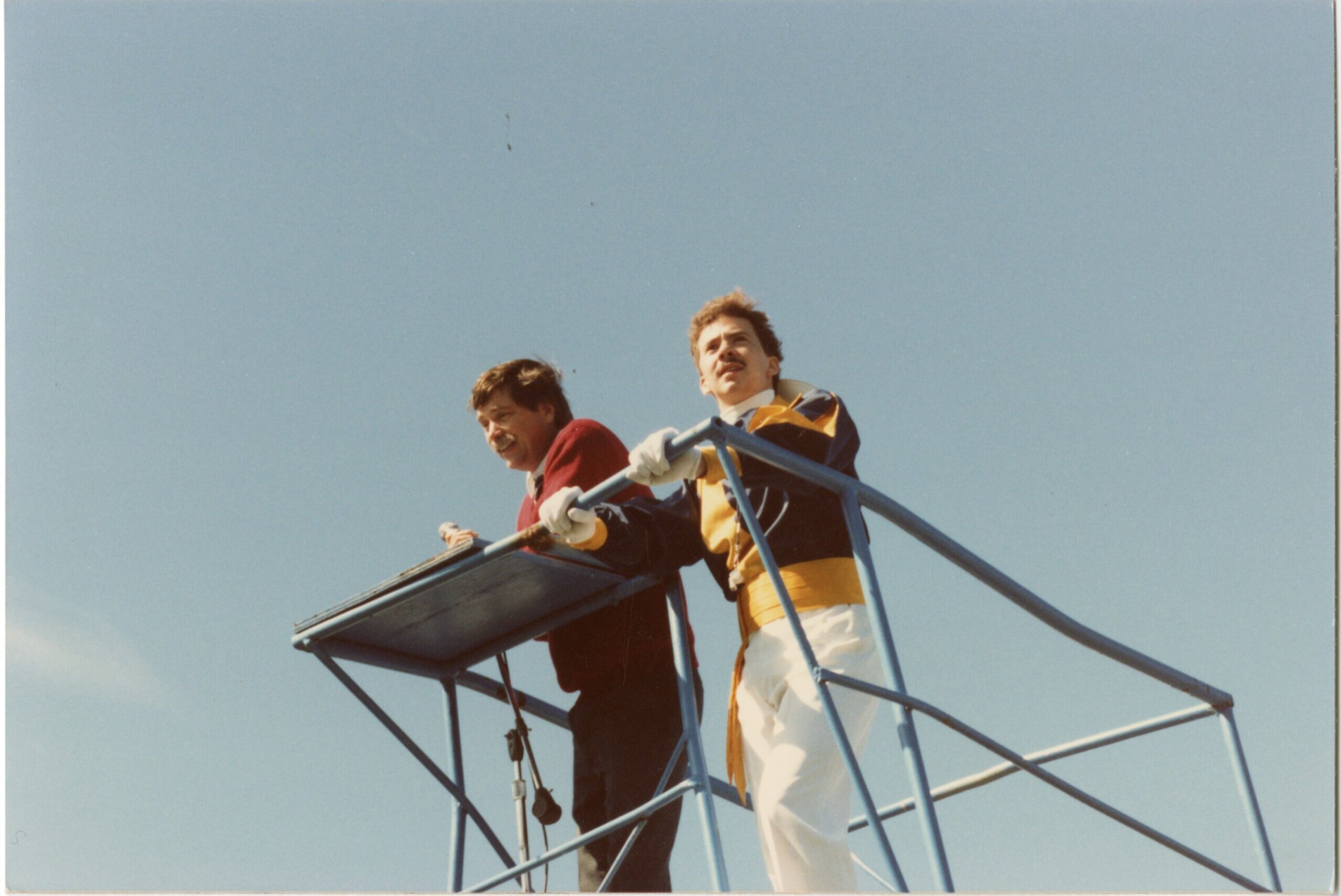 Ron Crocker and a drum major lead the UNK marching band in the late 1980s.