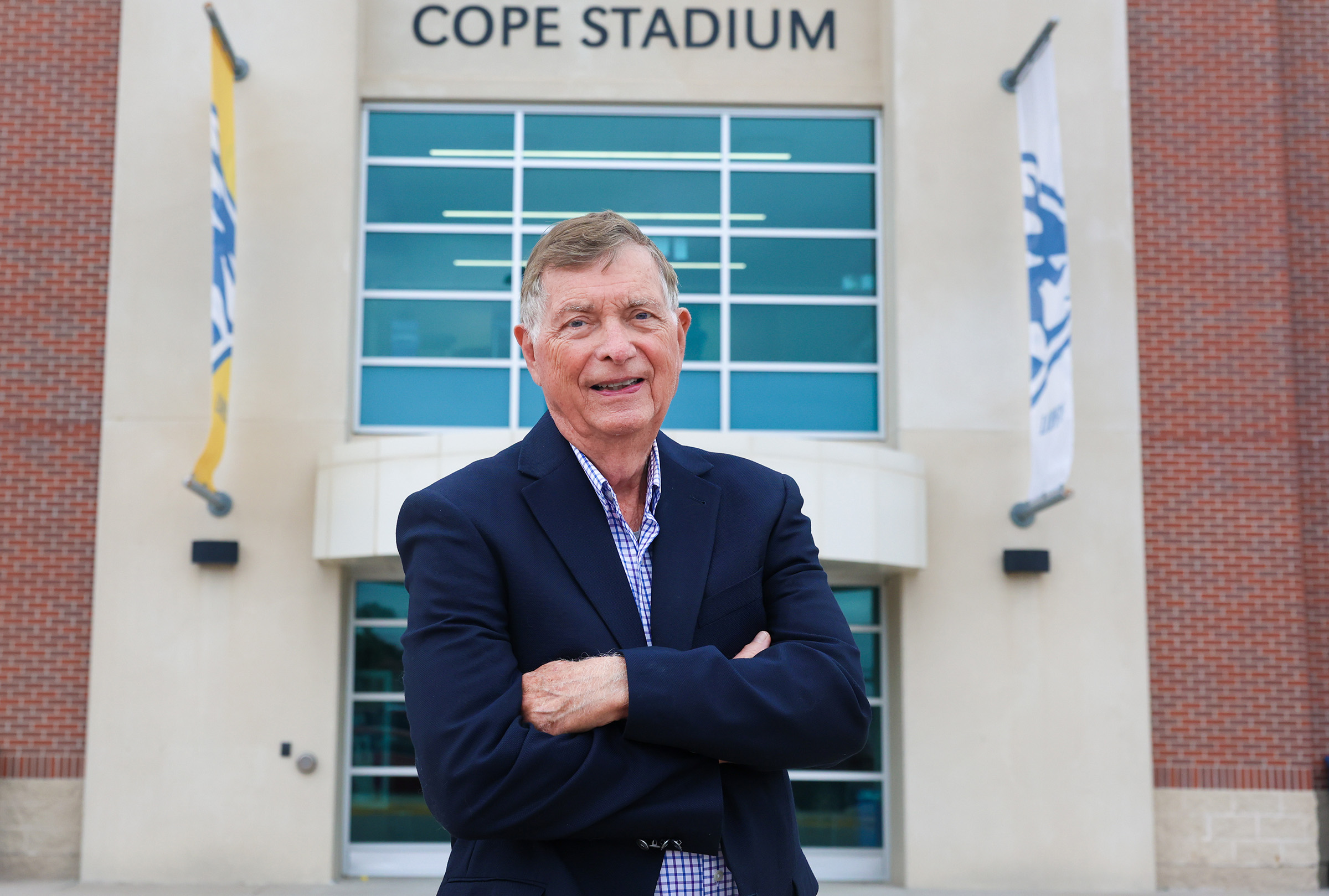 Ron Crocker poses for a photo outside Cope Stadium.