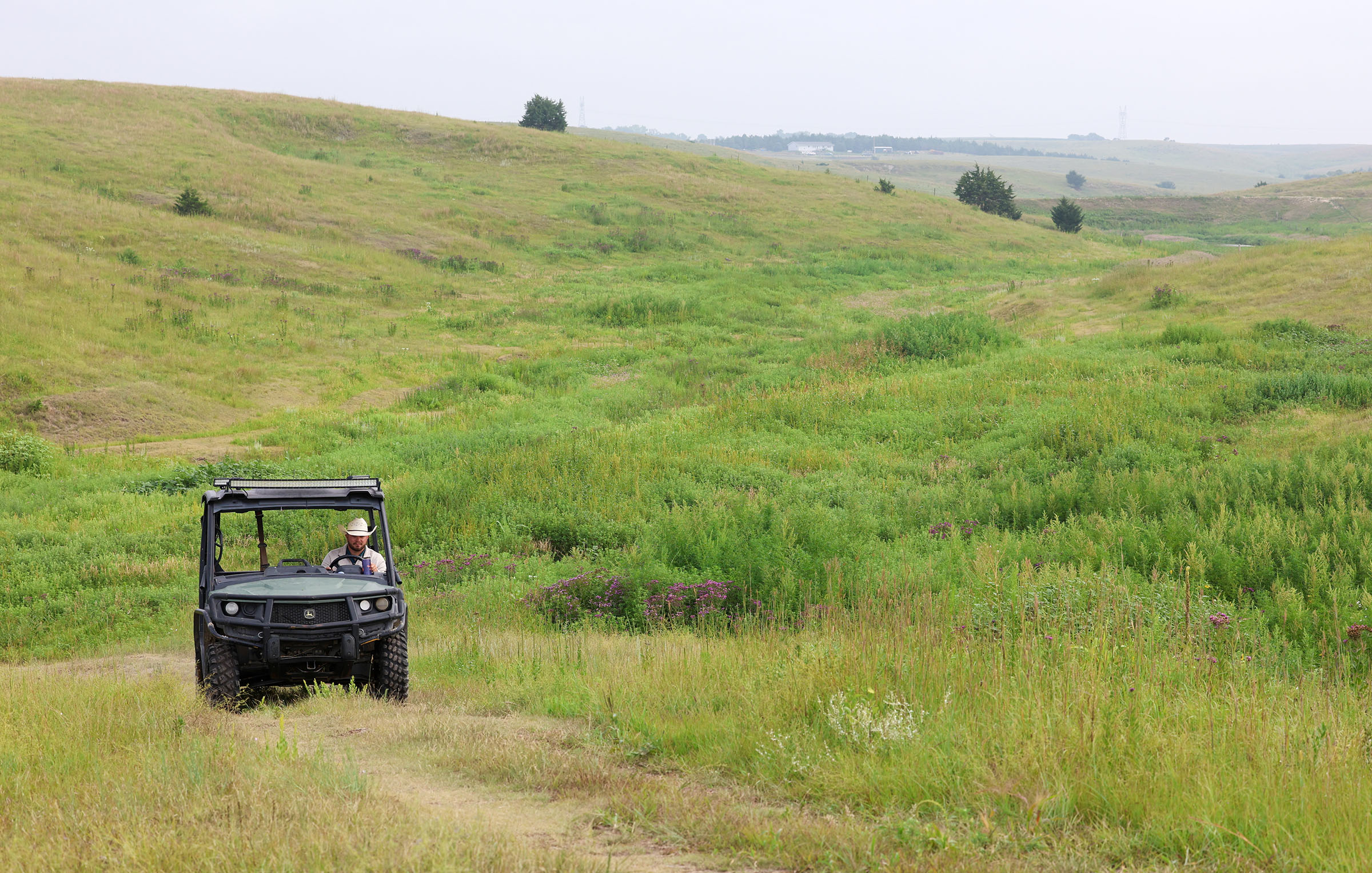 Ryan Arbuthnot drives a UTV at the family ranch.