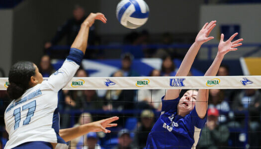 Sydney Davis elevates for a block against Washburn.