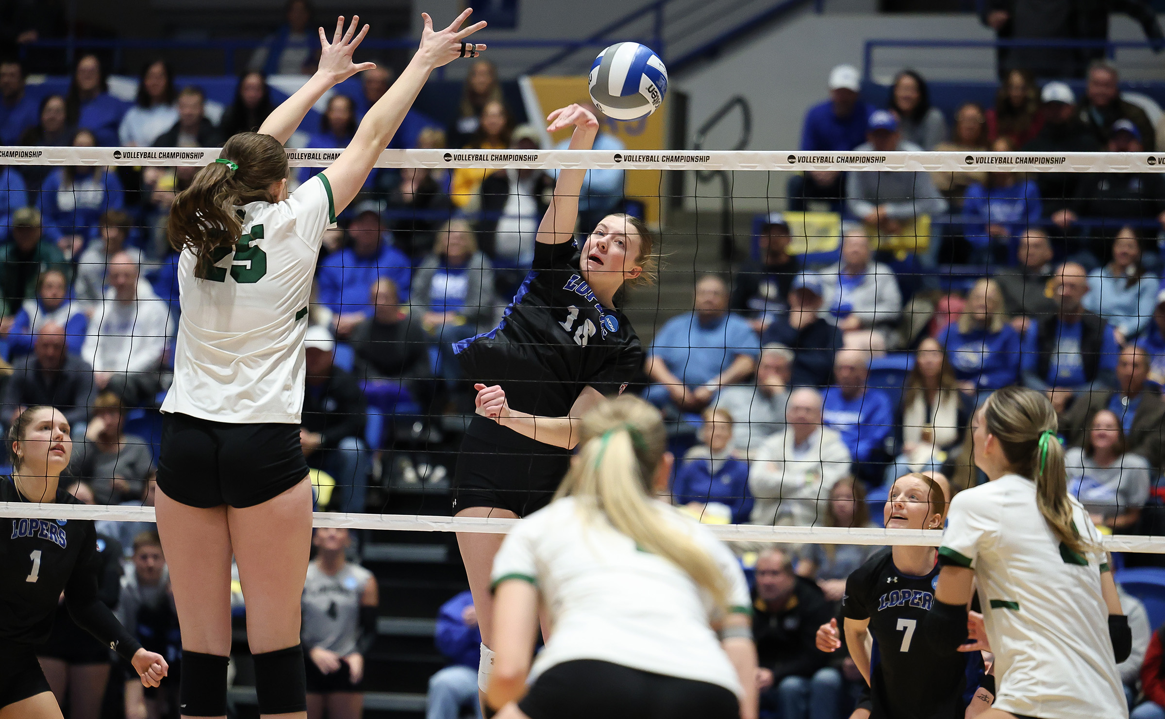 Sydney Davis records a kill for UNK volleyball.