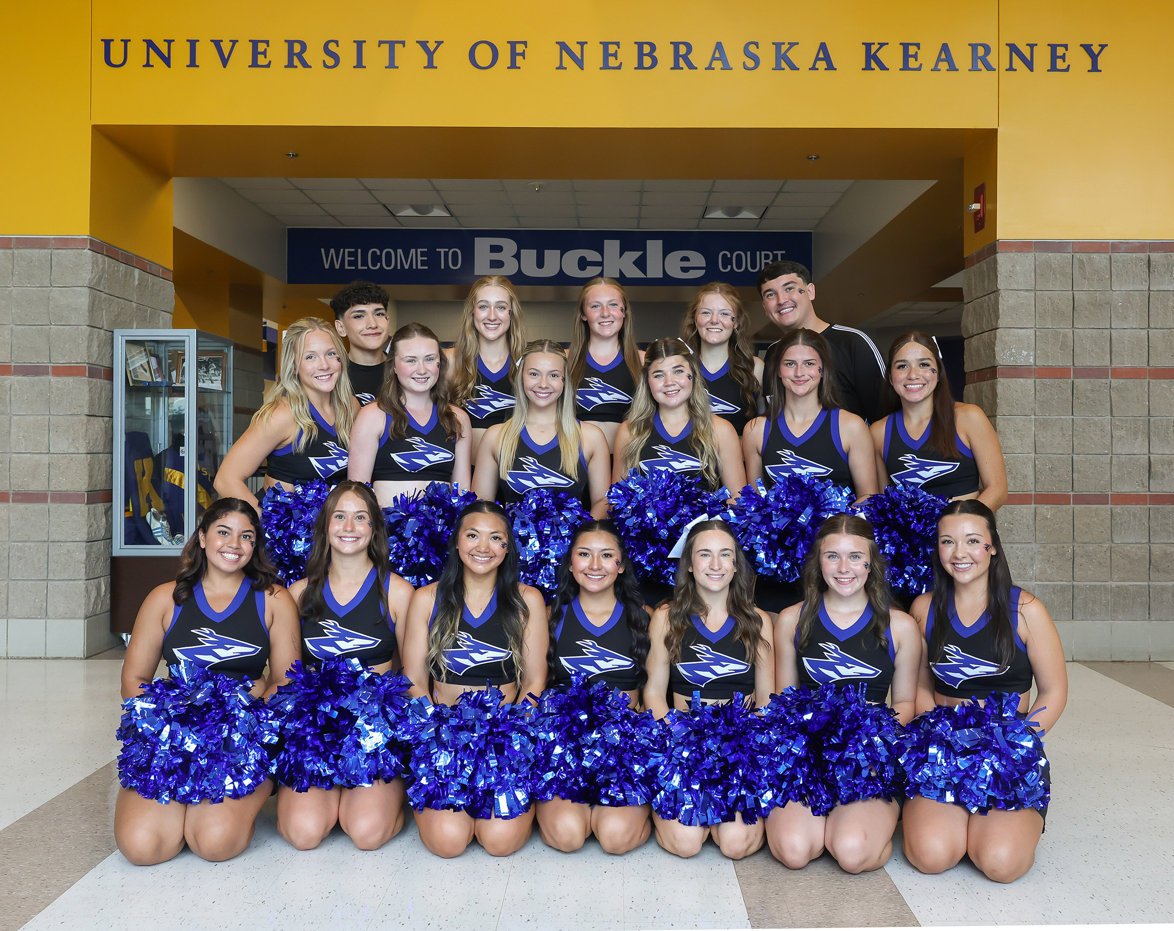 A group photo of the UNK cheer team.