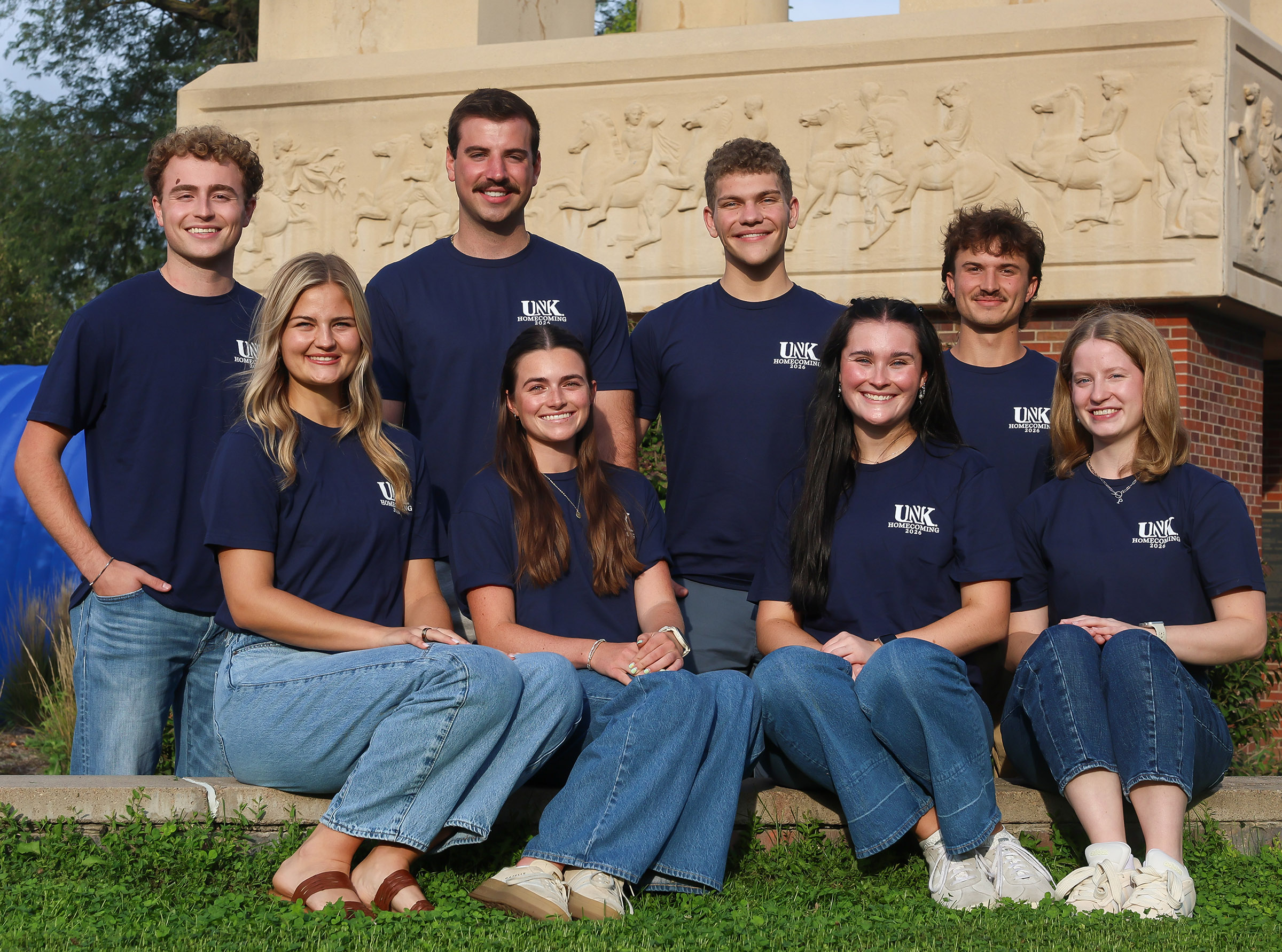 UNK homecoming royalty finalists pose for a photo on campus.