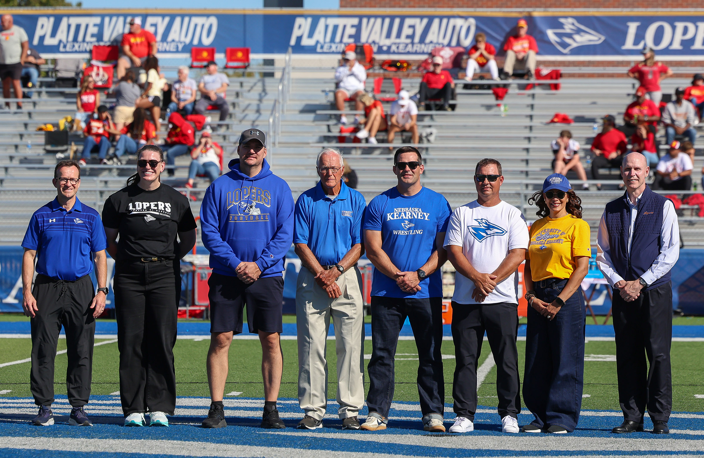 The 2026 UNK Athletic Hall of Fame inductees are recognized during halftime of the homecoming football game.