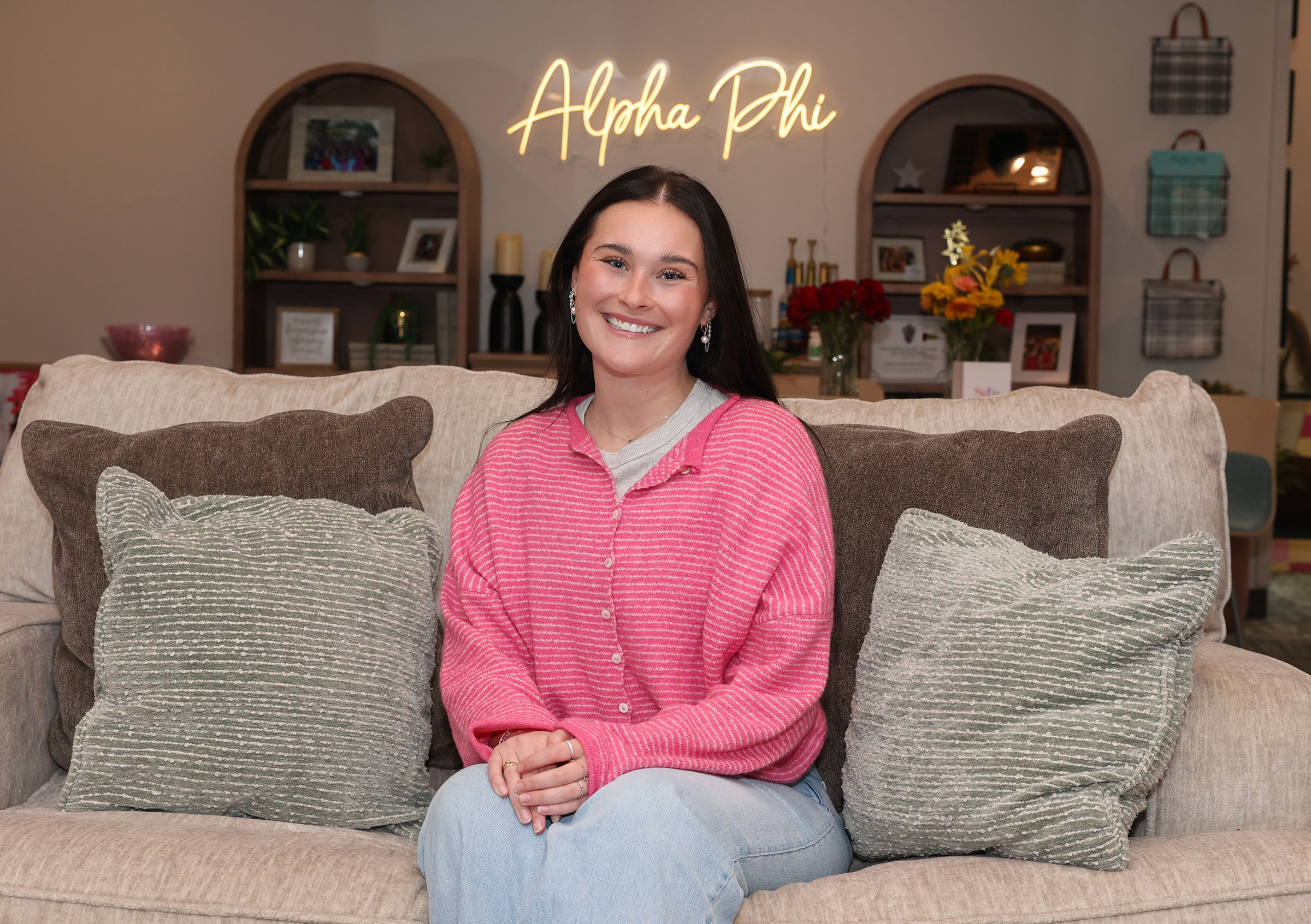 Addison Chapman poses for a photo in the Alpha Phi housing on the UNK campus.