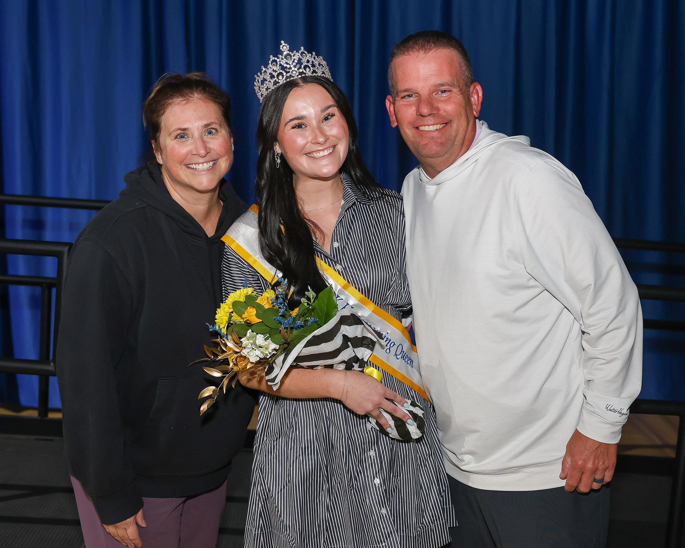 UNK homecoming queen Addison Chapman is pictured with her parents, Kerry and Tony, during the crowning ceremony earlier this month.